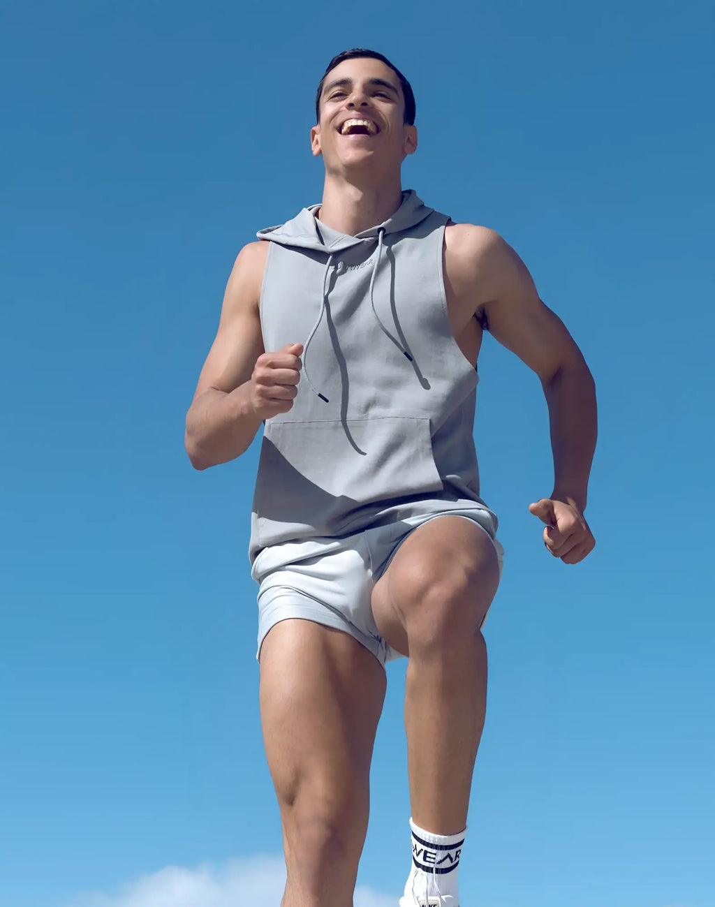 SupaWear sleeveless hoodie in light gray with front pocket and drawstrings made of soft breathable fabric