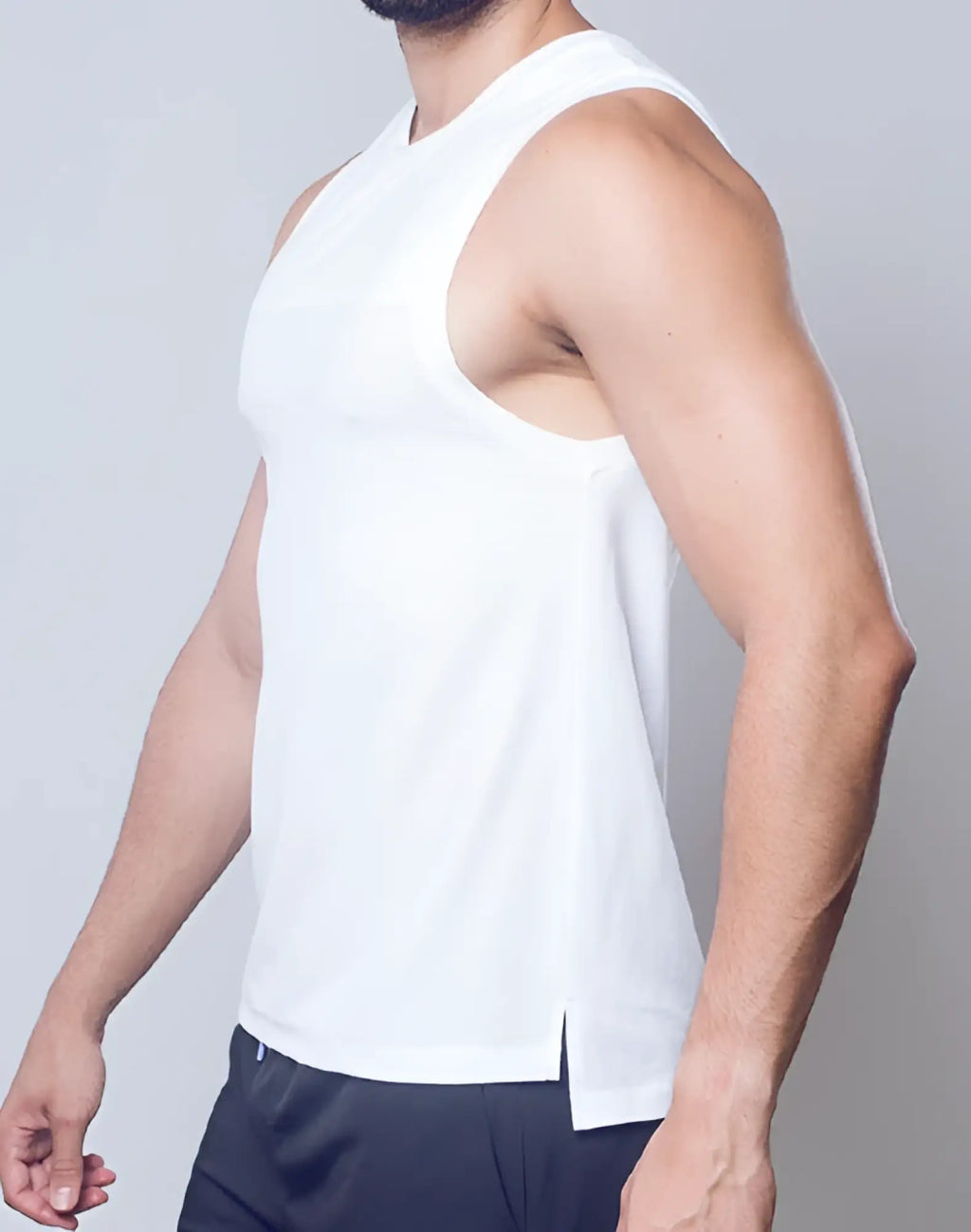 White mesh sleeveless athletic tank top with subtle side slit from SUPAWEAR solid and mesh tanktop collection