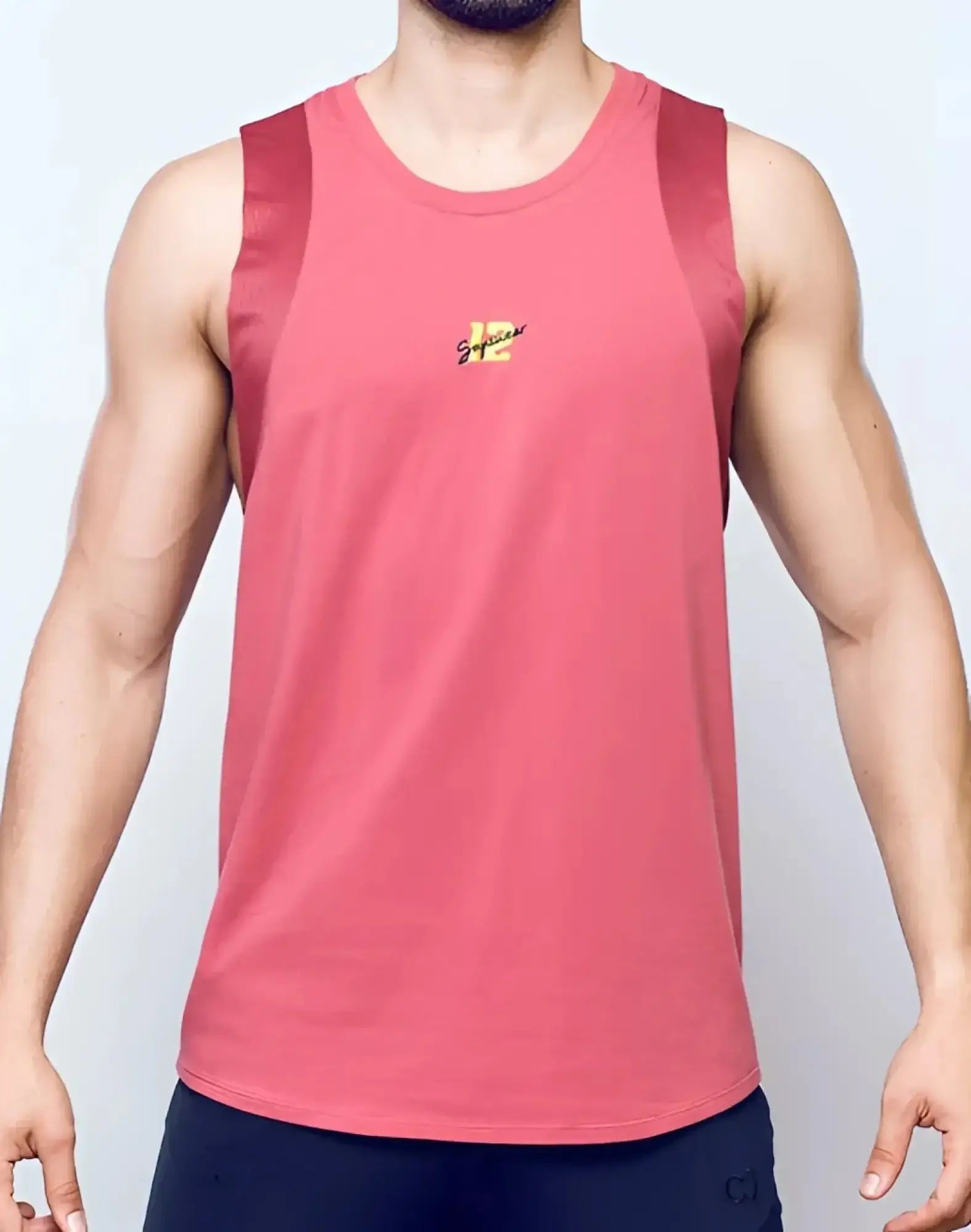 SupaWear sport tank top in dusty cedar rose with coral color mesh shoulder panels and small chest embroidered logo