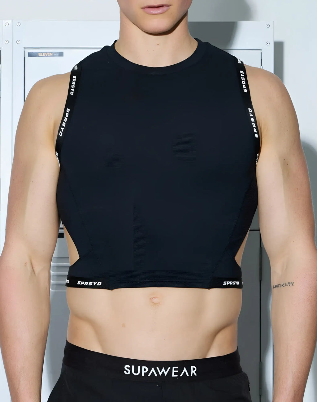 Black sleeveless SUPAWEAR SPR cropped tank with sprsyd branding on straps and hem made of stretchy athletic fabric
