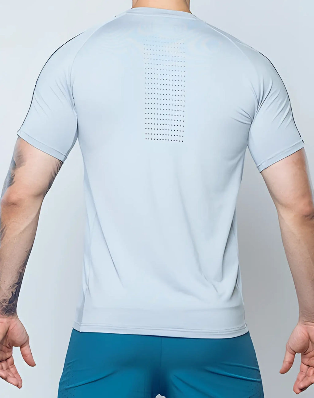 Back view of supawear SPR fit tee pale grey light blue short-sleeved athletic shirt with perforated vertical panel