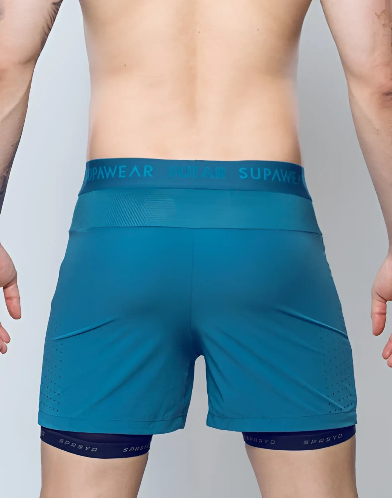 Teal supawear spr flex shorts with mesh waistband and perforated side panels in coral blue for athletic use