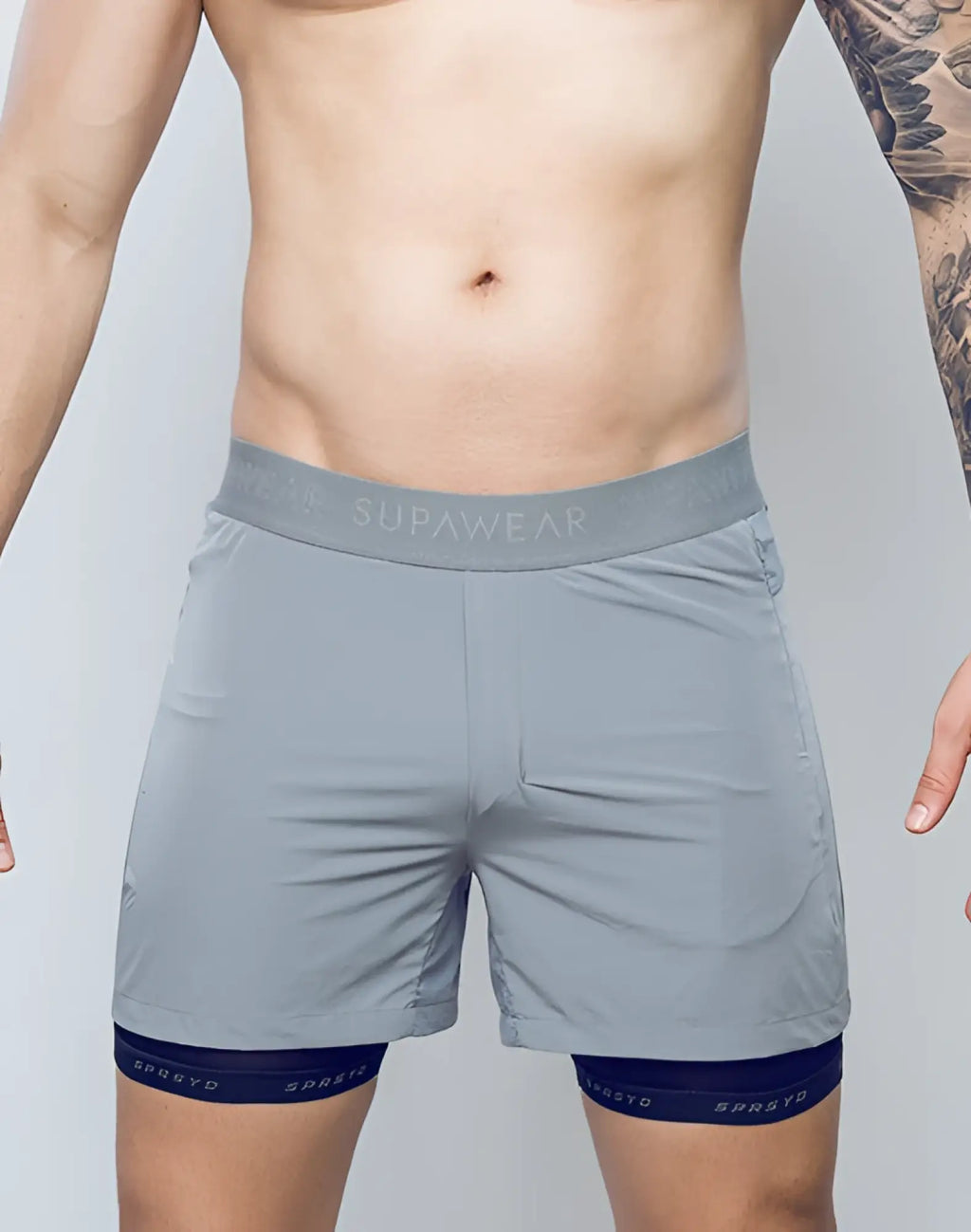 SupaWear SPR Flex shorts in titanium grey with matching waistband and navy blue inner lining for athletic use