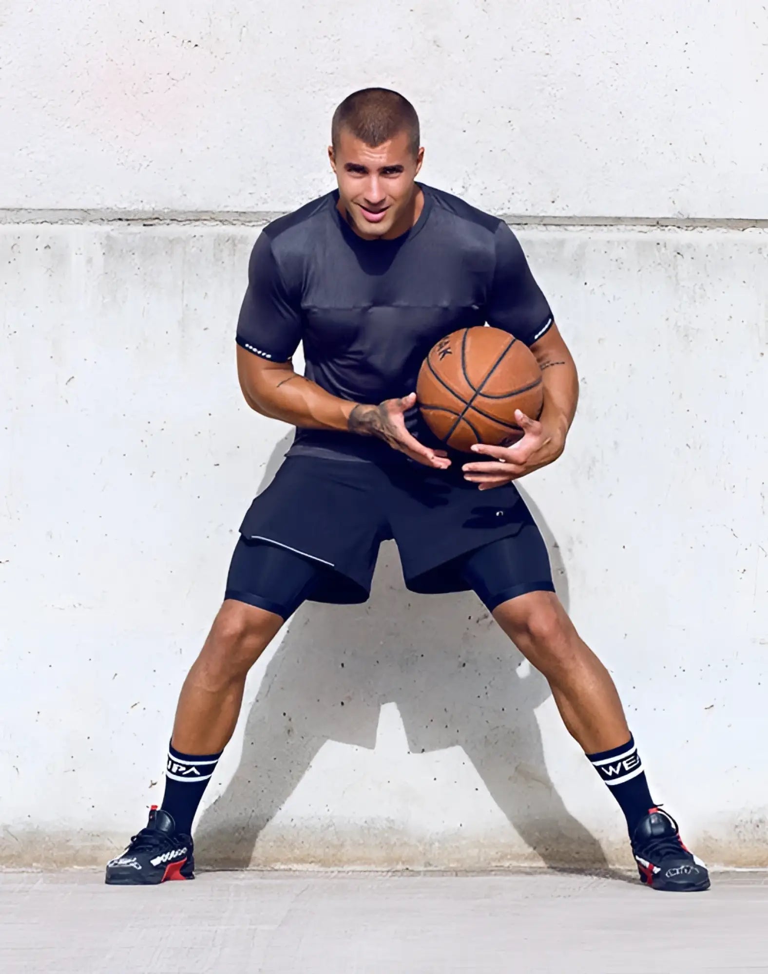 Orange leather basketball with black seams paired with supawear spr flex tee black for athletic performance