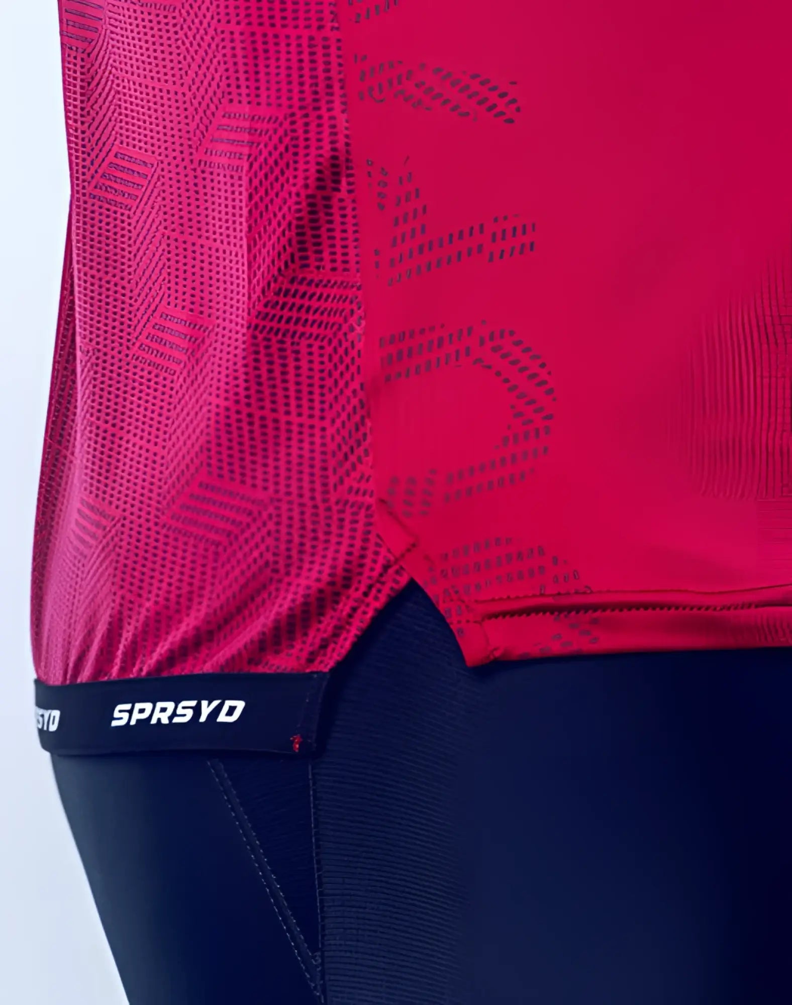 SupaWear SPR Flex tee redbud vibrant red athletic top with subtle geometric pattern and black sprsyd branded waistband