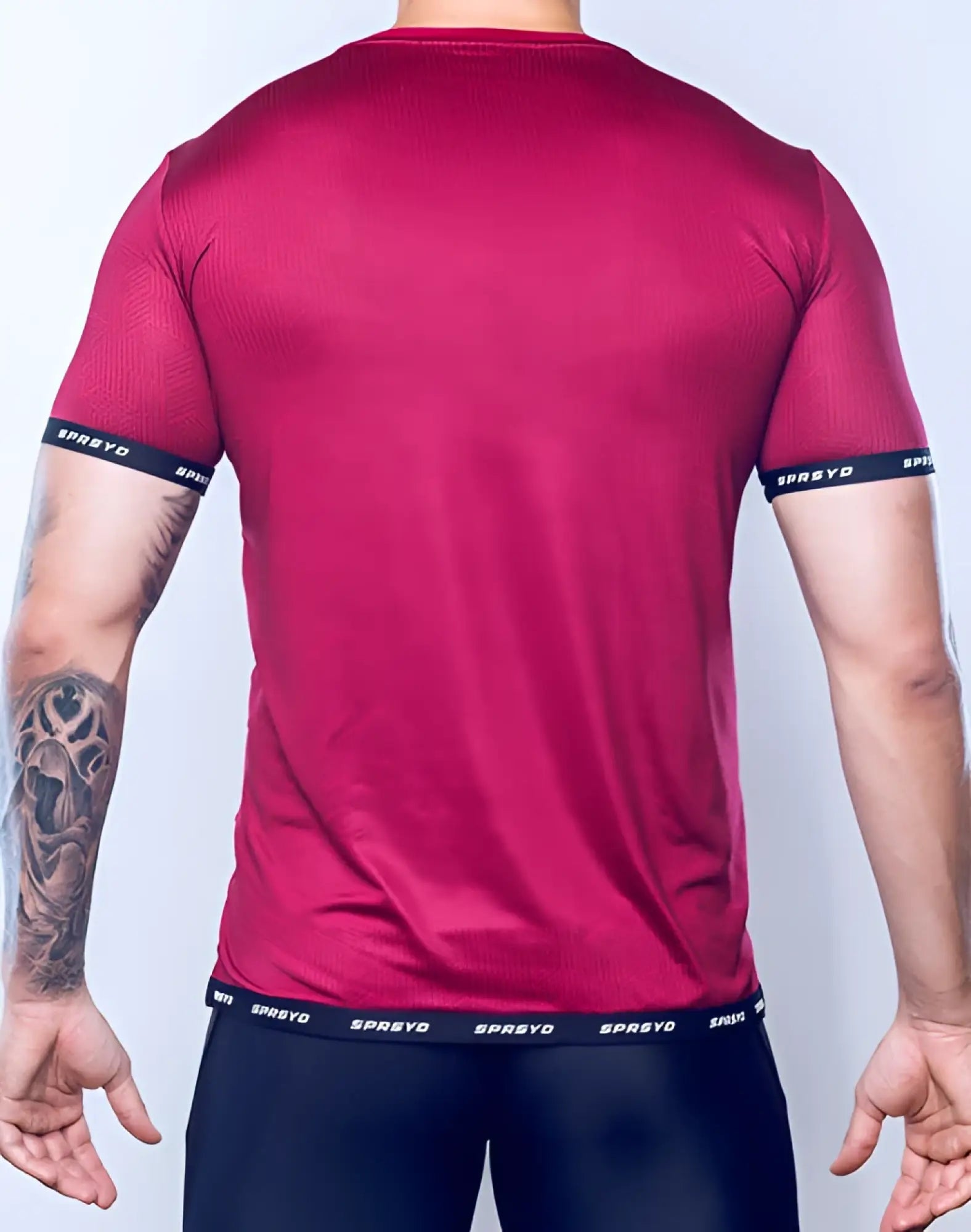 A vibrant red supawear spr flex tee with textured pattern black trim and spreyd logo on sleeves and waistband