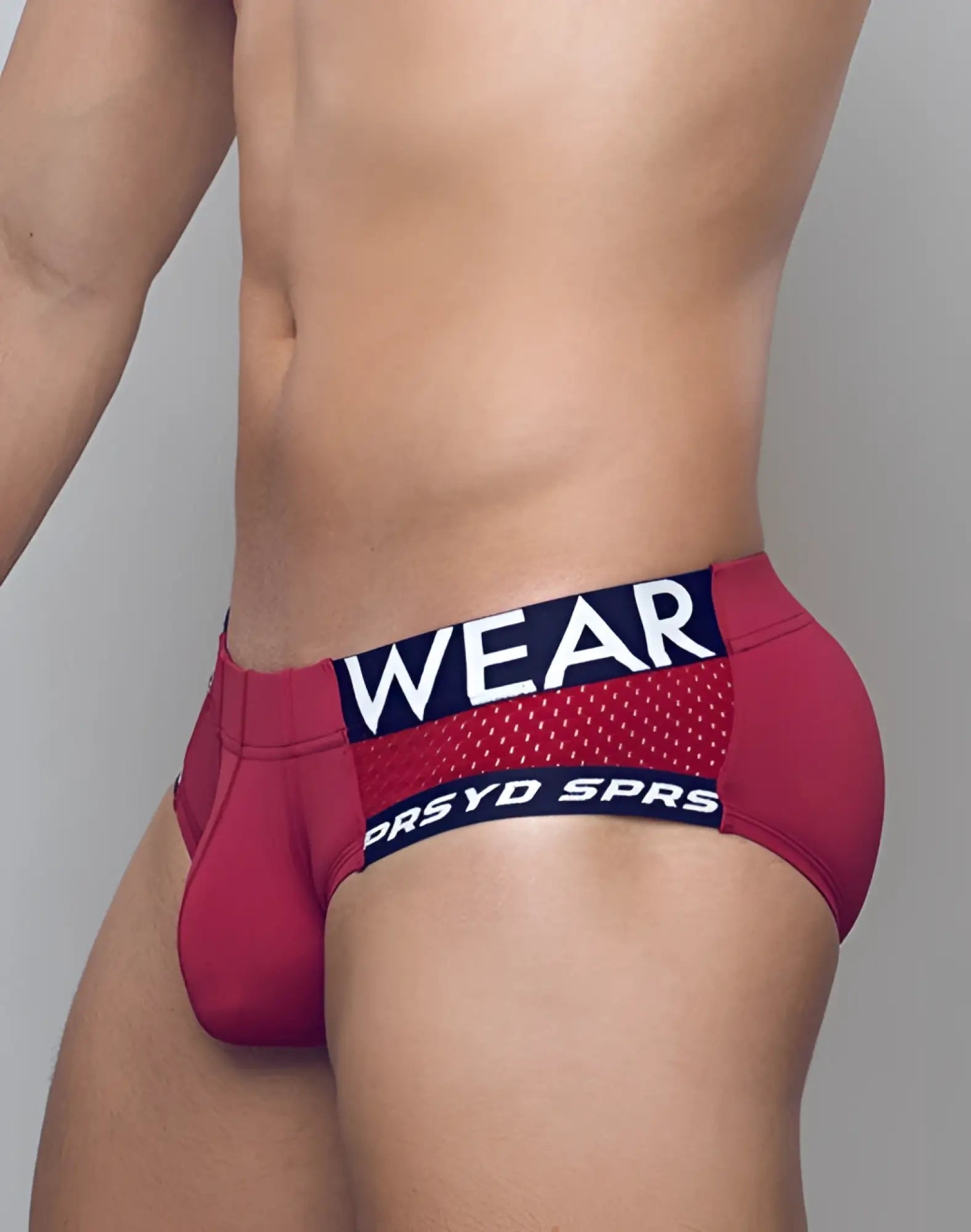 Red supawear spr max brief athletic underwear with navy blue elastic waistband and white lettering for active wear