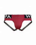 Red supawear spr max jockstrap underwear with black and white branded waistband and side straps in redbud color