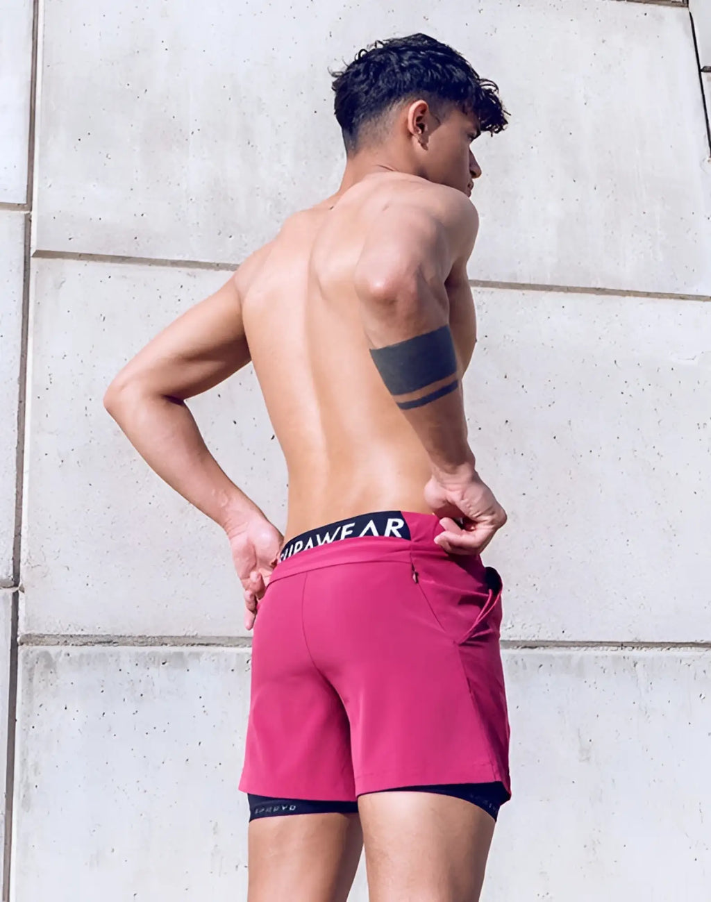 SupaWear SPR Max shorts in vibrant pink with black waistband and white lettering designed for active wear