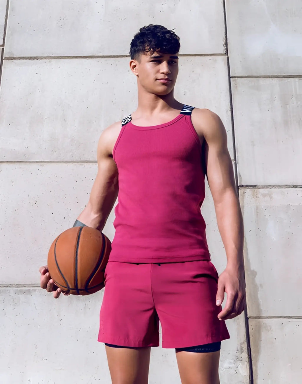 Supaweart spr max singlet in redbud with classic orange leather basketball texture and black stitched seams visible