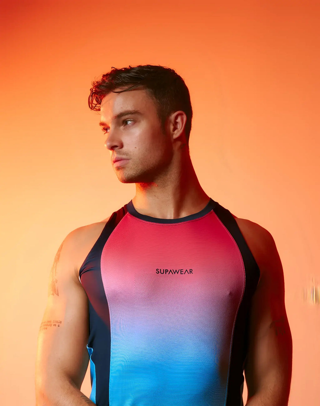SupaWear SPR performance gradient singlet with pink to blue ombre and black shoulder panels for athletic use
