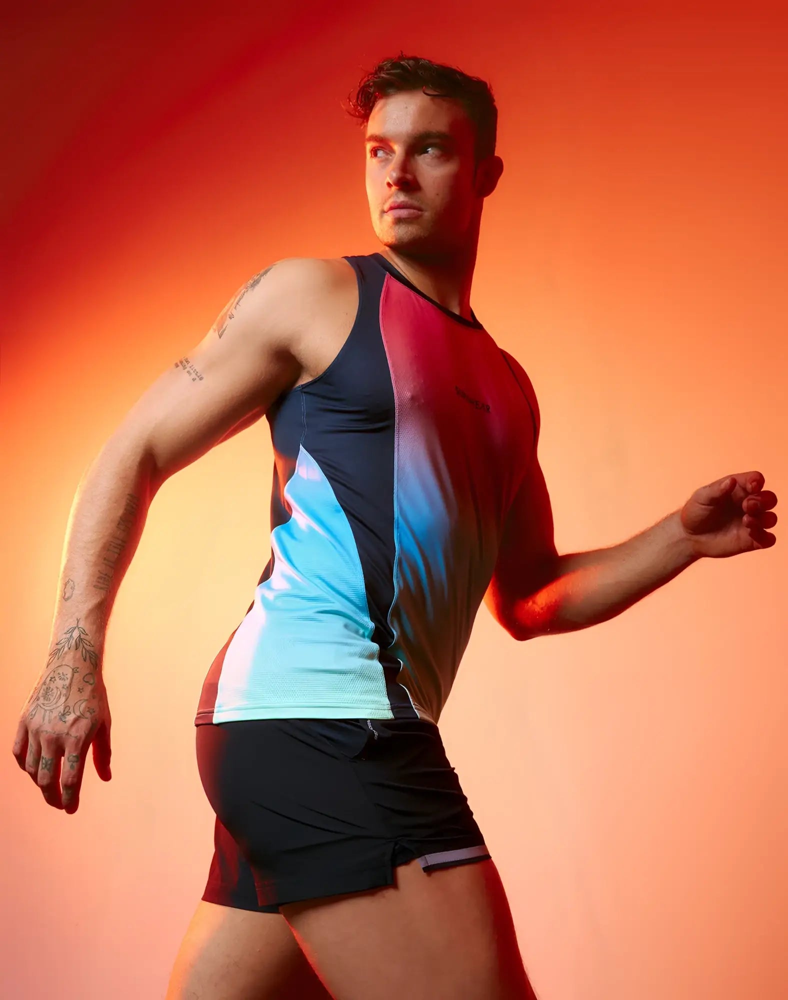 SupaWear SPR performance gradient singlet is a sleek athletic tank top with navy blue to red and light blue panels