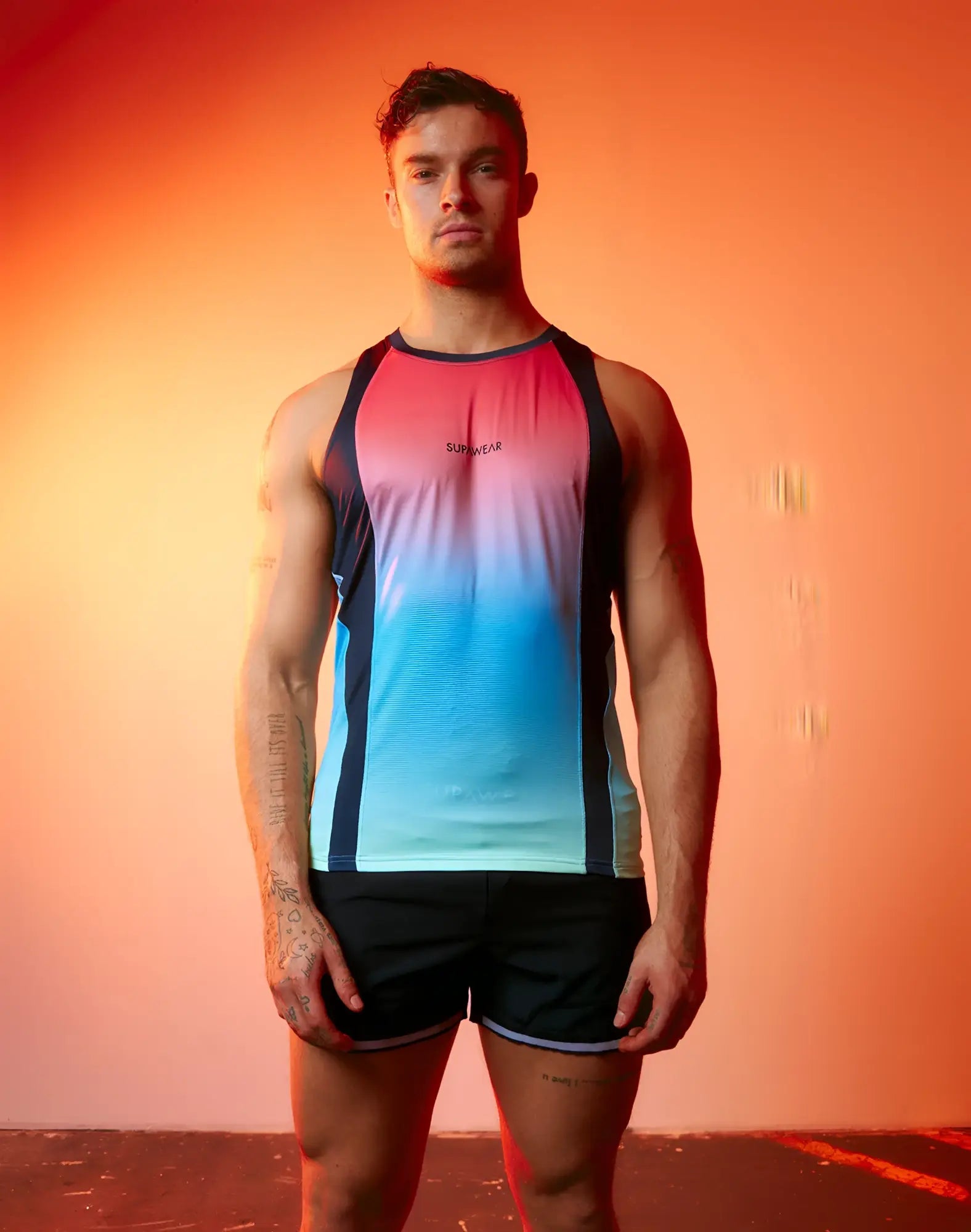 SupaWear SPR performance gradient singlet with vibrant pink to blue ombre and black side panels featuring Sunwear logo