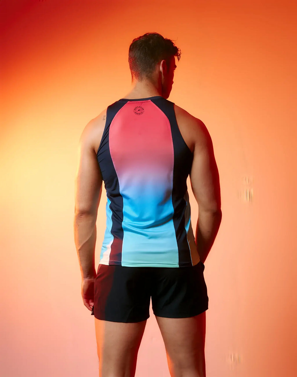 SupaWear SPR performance gradient singlet tank top with pink to blue fade black side panels and logo at neckline