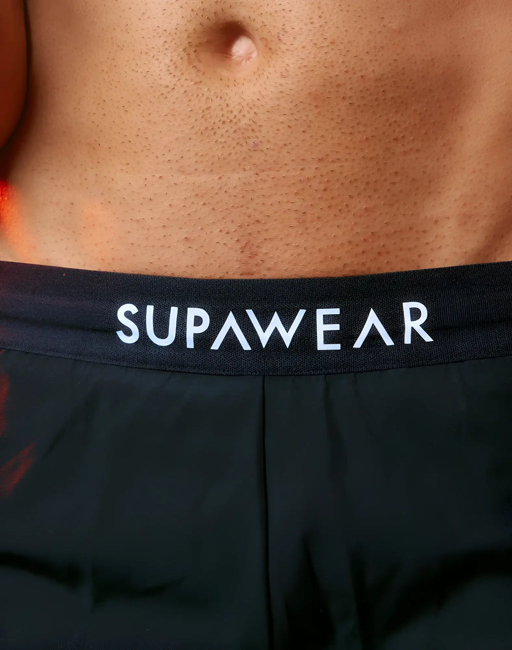 Black supawear spr performance shorts featuring white lettering on the waistband for activewear use