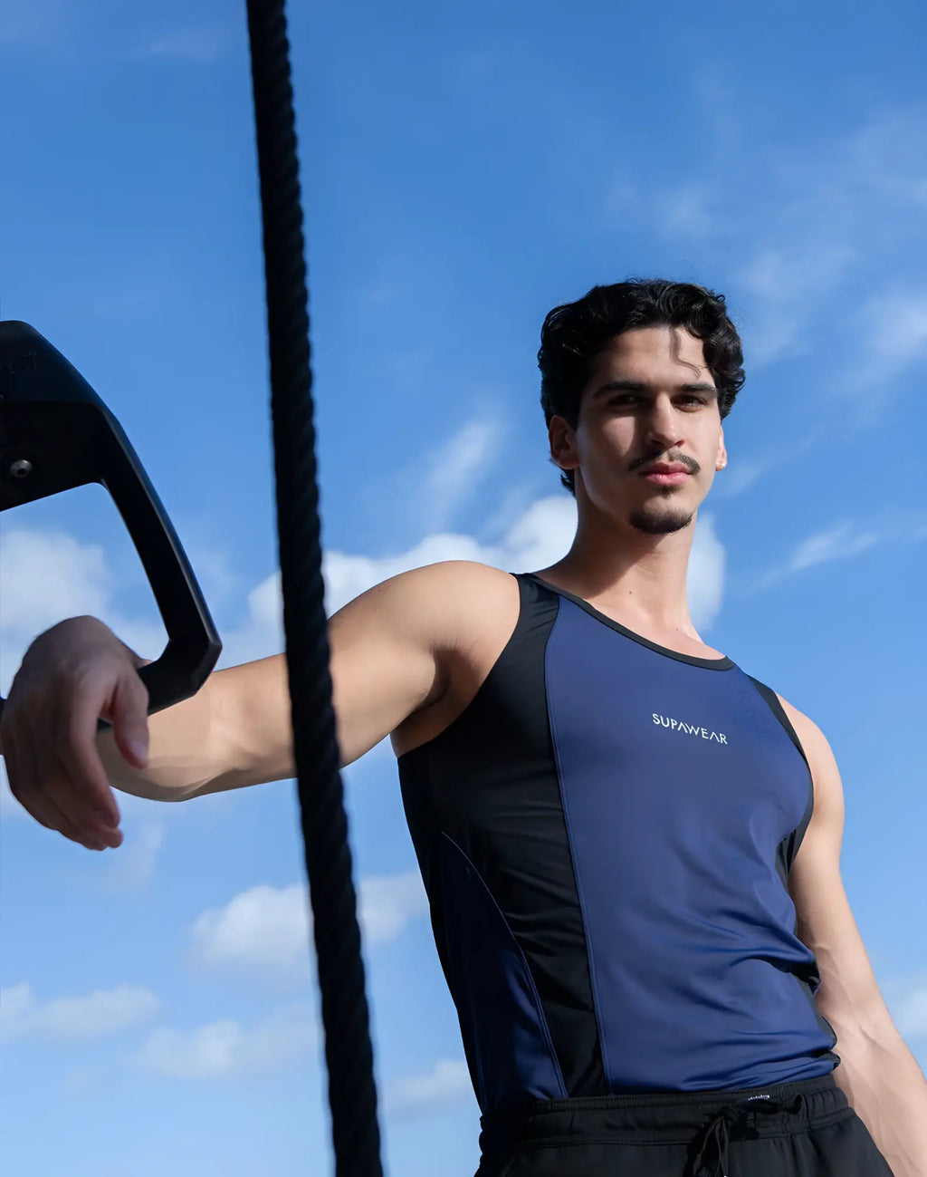 Blue and black supawear athletic tank top with sleek performance design for high intensity workouts