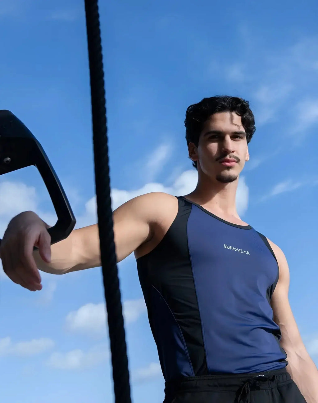 Blue and black supawear athletic tank top with sleek performance design for high intensity workouts