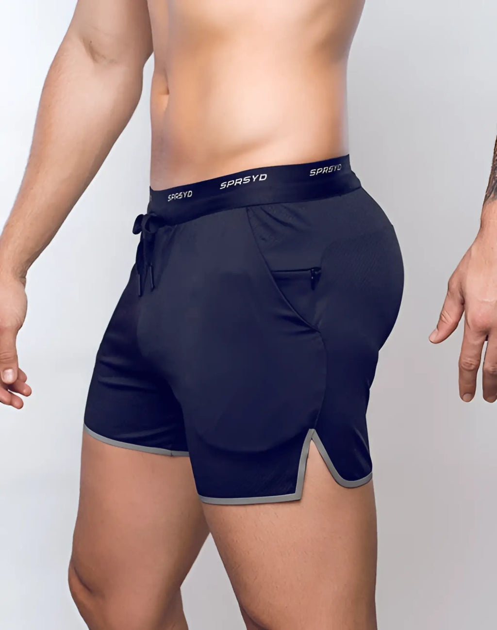 Navy blue SUPAWEAR SPR racer shorts with gray trim drawstring waistband and sprsyd logo for athletic use