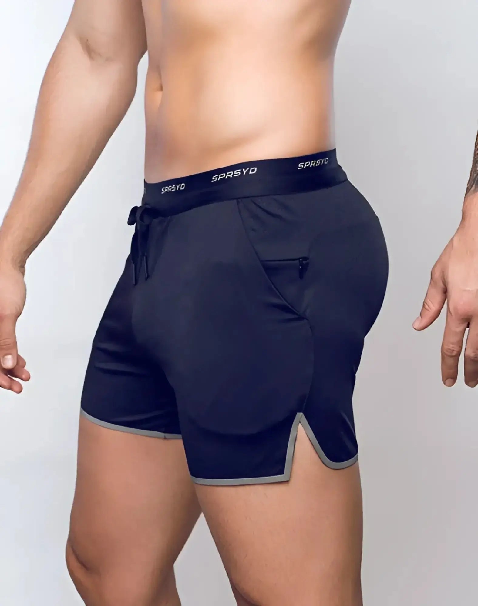 Navy blue SUPAWEAR SPR racer shorts with gray trim drawstring waistband and sprsyd logo for athletic use