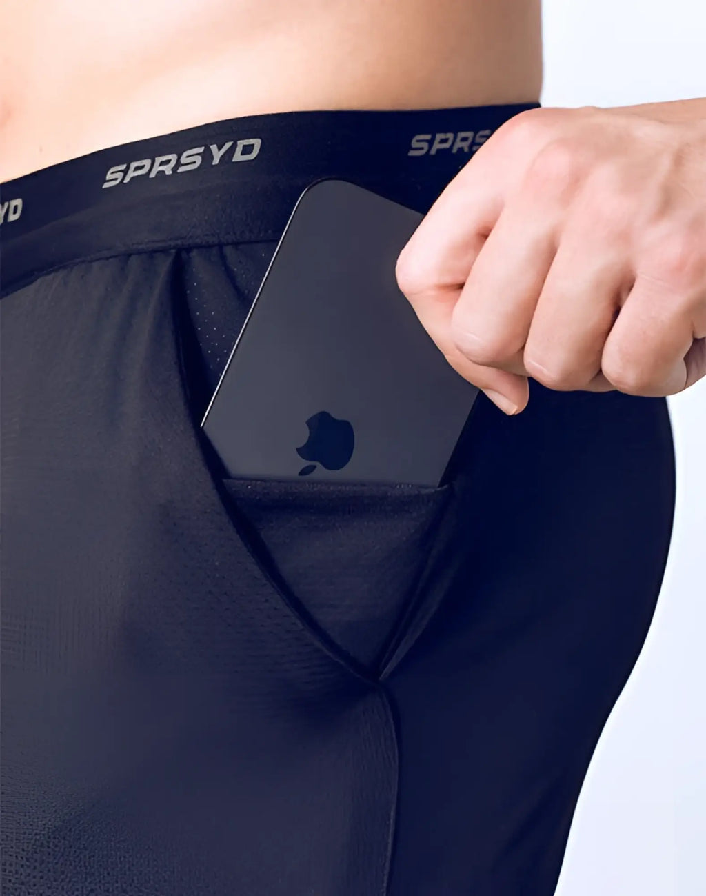 Black supawear spr racer shorts shown with a black glossy apple smartphone tucked into the dark navy pant pocket