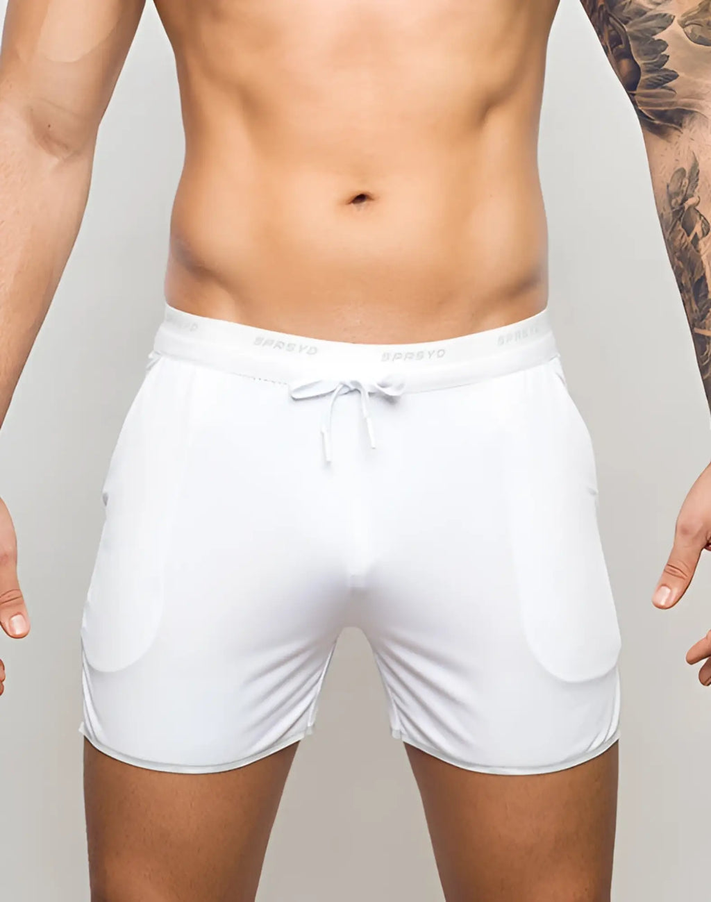 SupaWear SPR Racer shorts in white mesh with a drawstring waistband and subtle branding for athletic use