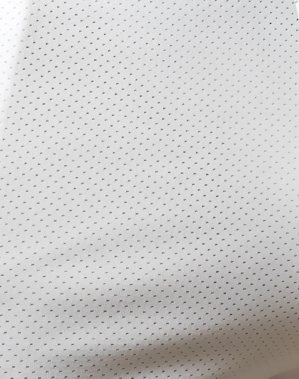 White supawear spr racer shorts featuring perforated mesh fabric with a fine uniform pattern of small holes
