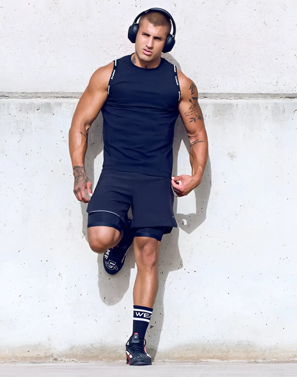 SupaweaR SPR singlet black athletic tank top with subtle white side stripes designed for performance and comfort