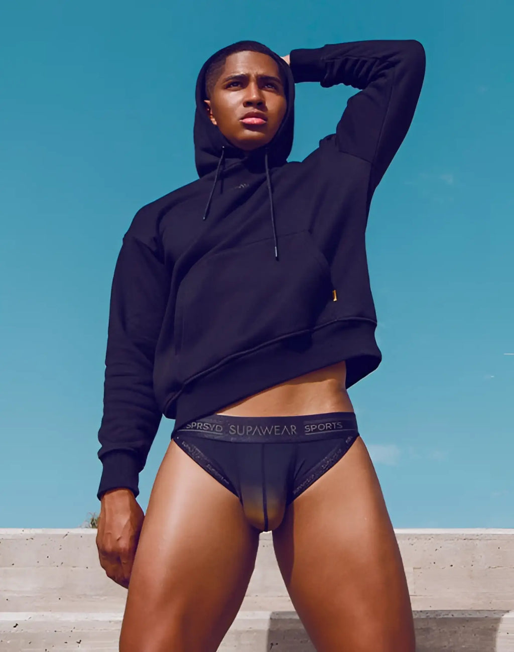 Black supawear spr training briefs with subtle textured pattern and logo waistband designed for active wear