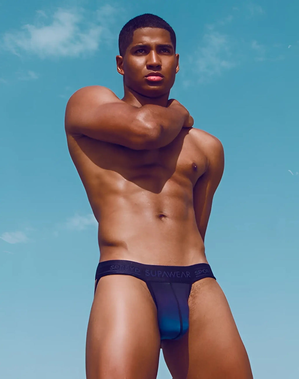 Navy blue supawear spr training jockstrap briefs with gradient fade to lighter blue at leg openings for active wear