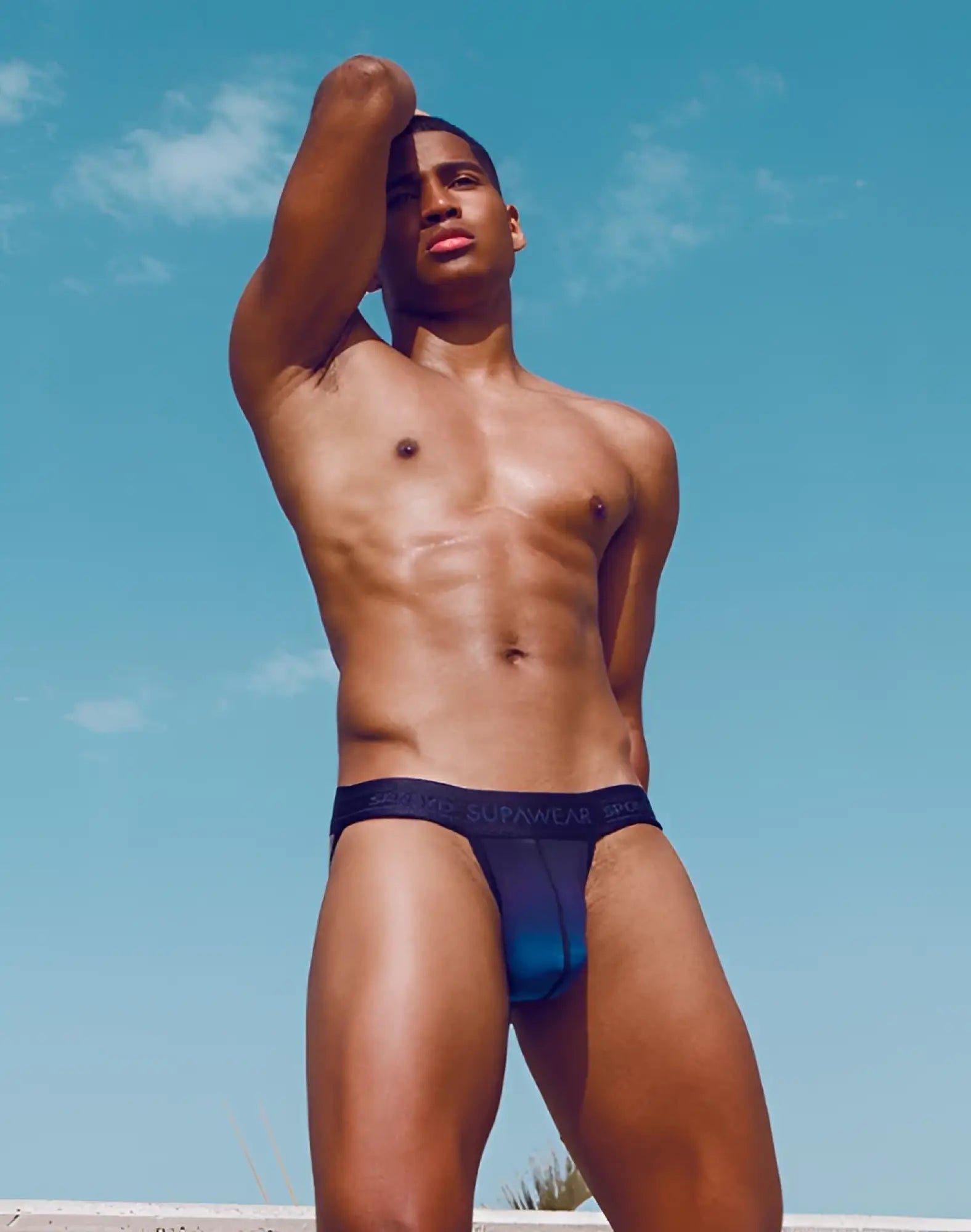 Navy blue supawear spr training jockstrap briefs with a subtle teal gradient for athletic support and comfort