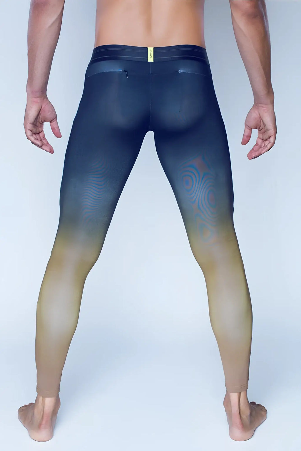 SupaWear SPR training tights in green with black and beige gradient leggings and subtle swirling thigh pattern