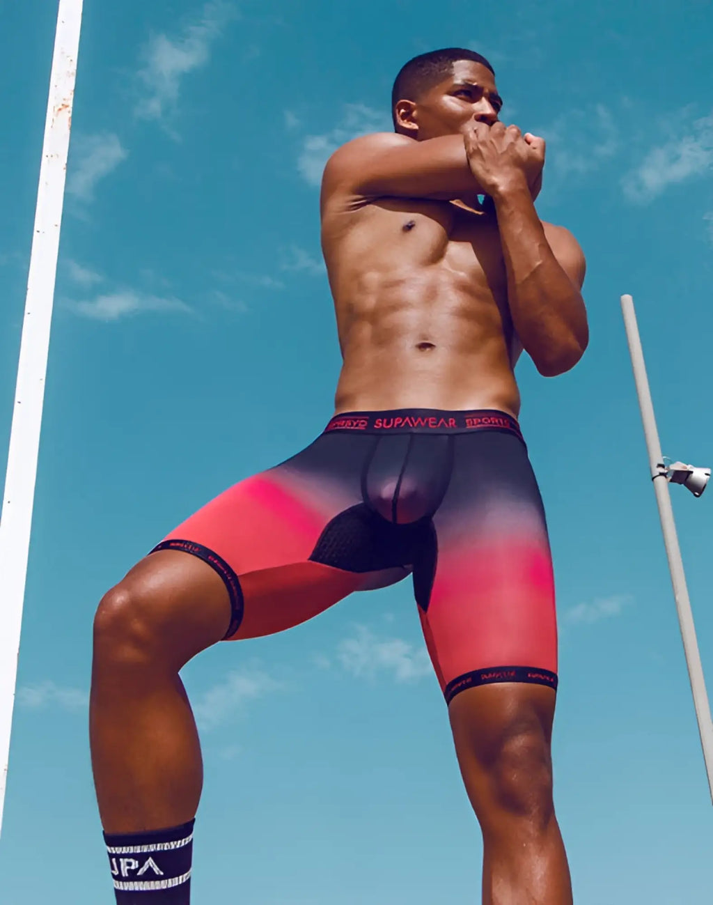 Men’s red and black gradient SUPAWEAR SPR training trunk athletic briefs with supawear sports branded waistband