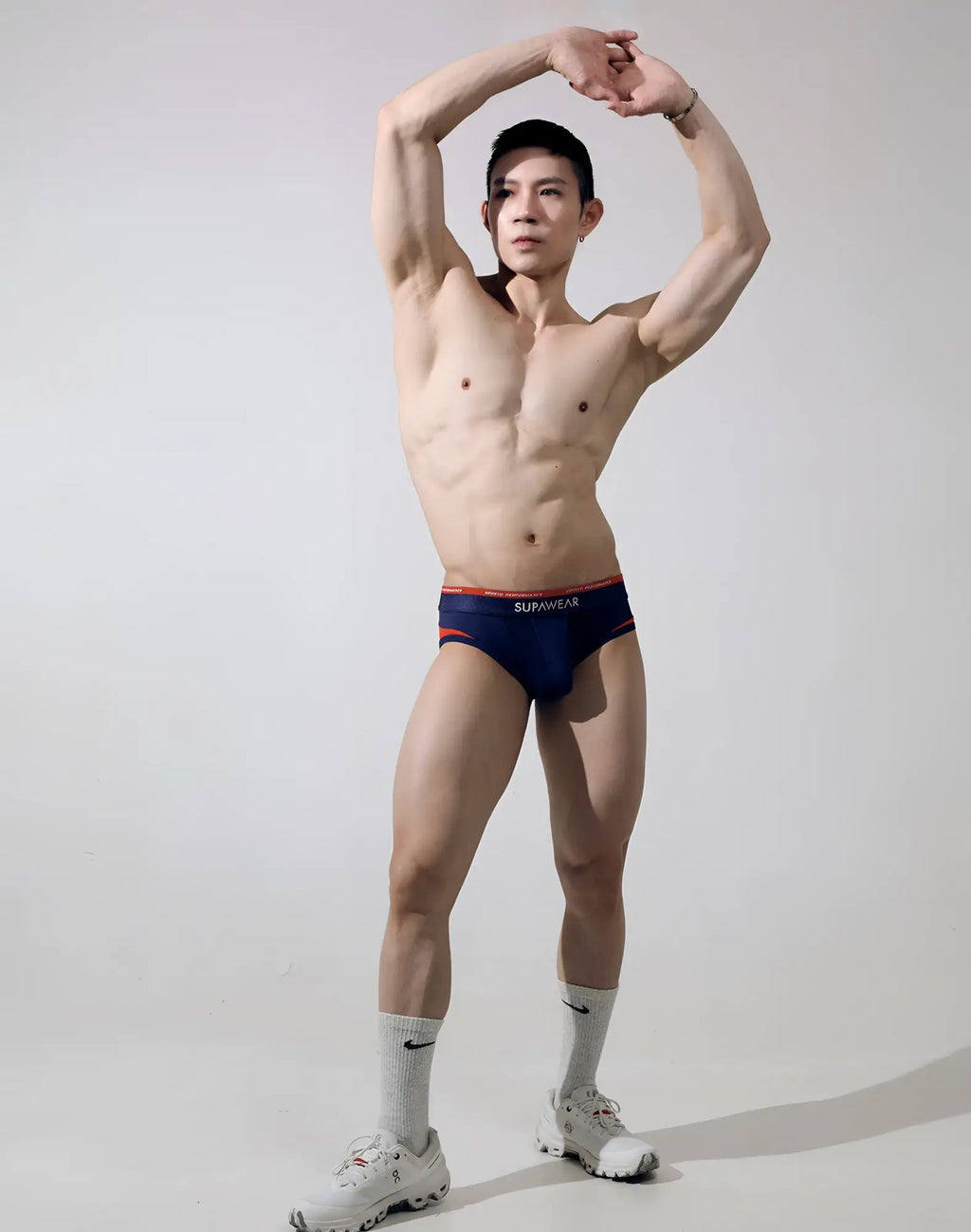 Navy blue SUPAWEAR SPR Verve briefs with orange trim and sumwear branded waistband for comfortable everyday wear
