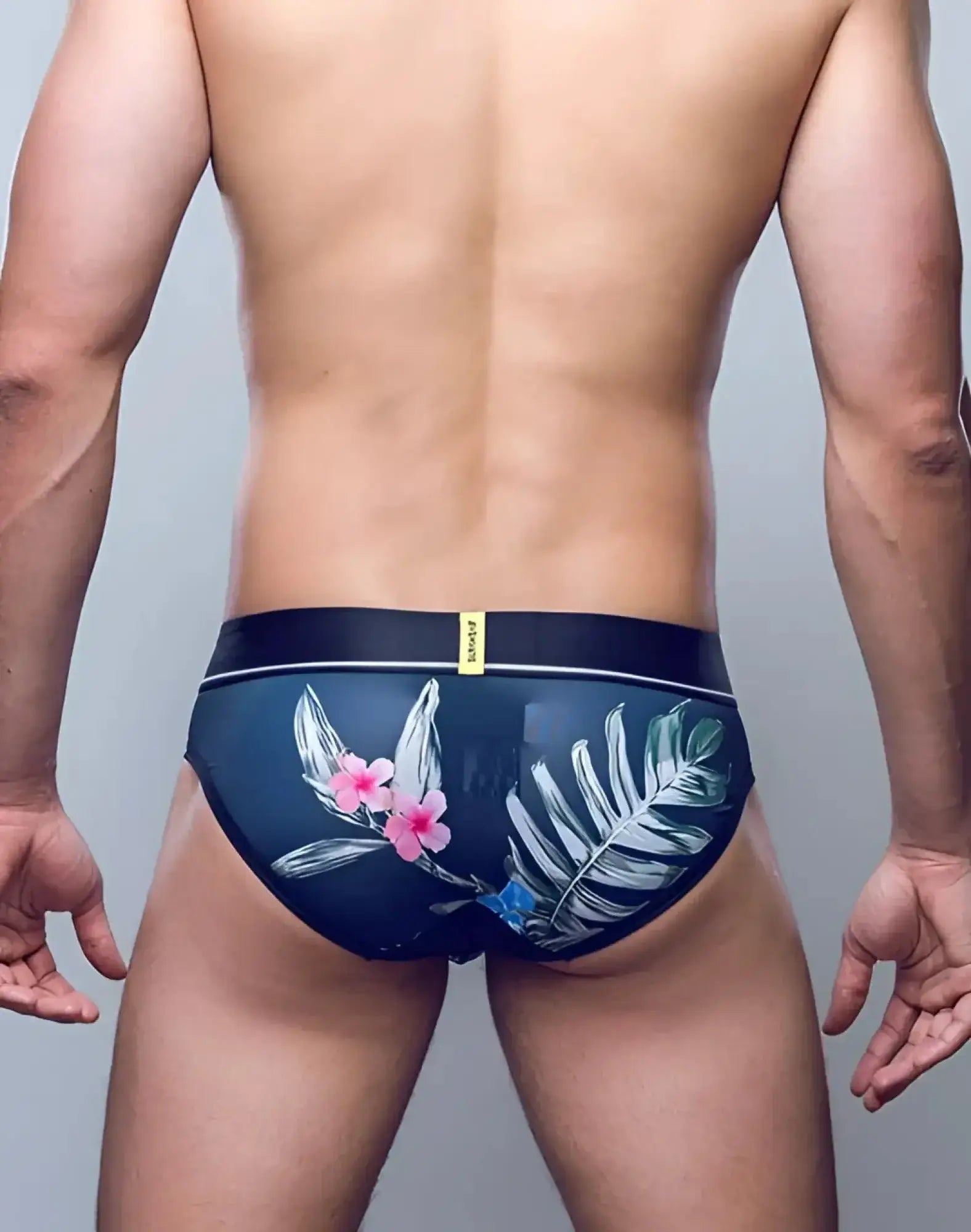 Supawee sprint brief underwear in dark blue with tropical pink flowers white green foliage and black waistband