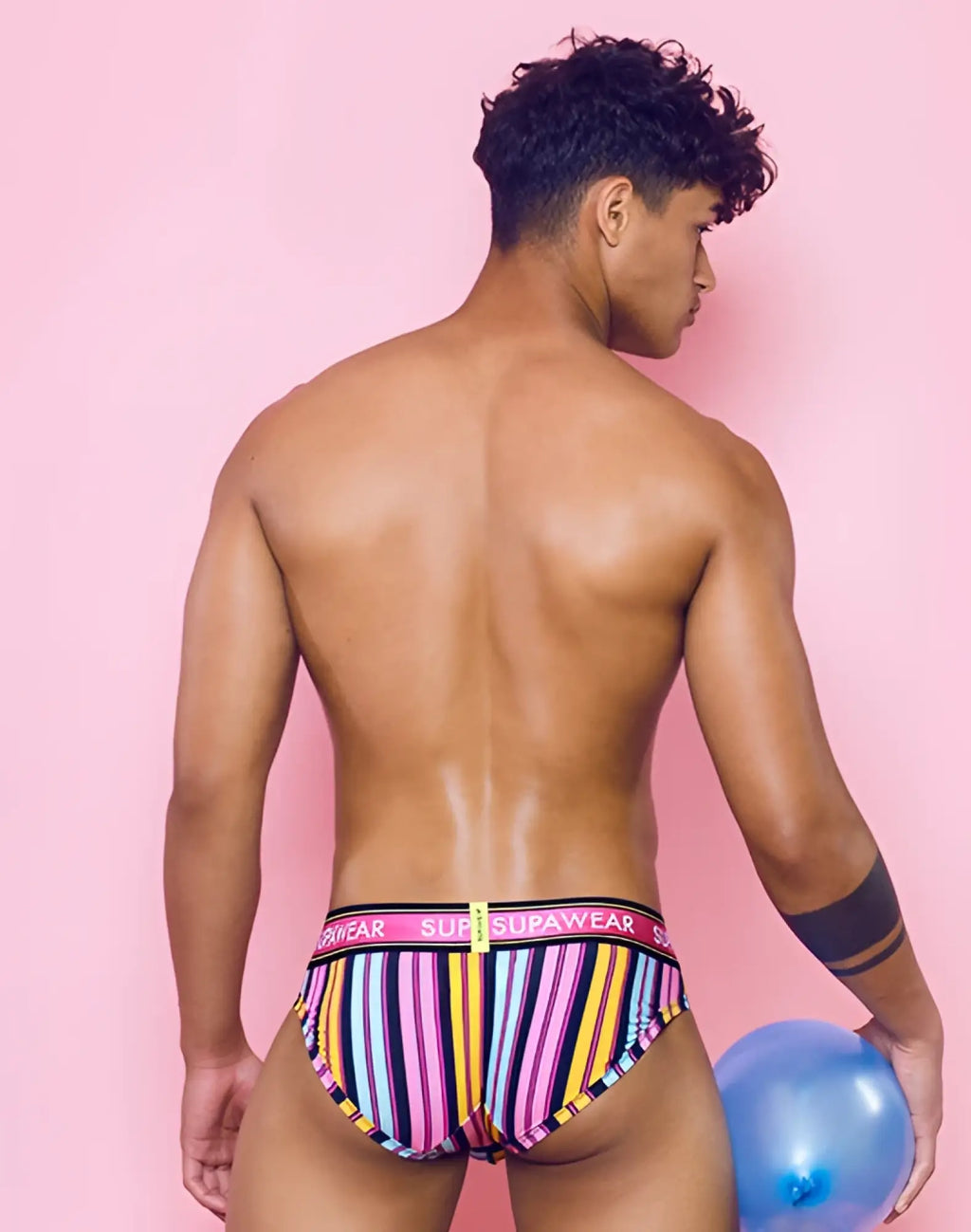 SupaWear sprint brief underwear with vibrant pink yellow purple stripes and bold Suprawear waistband for men