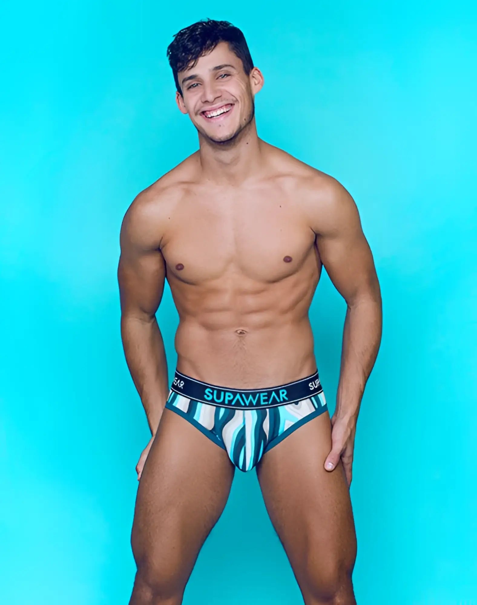 Supawear sprint brief underwear in blue and white stripes with a black waistband and teal supawear logo