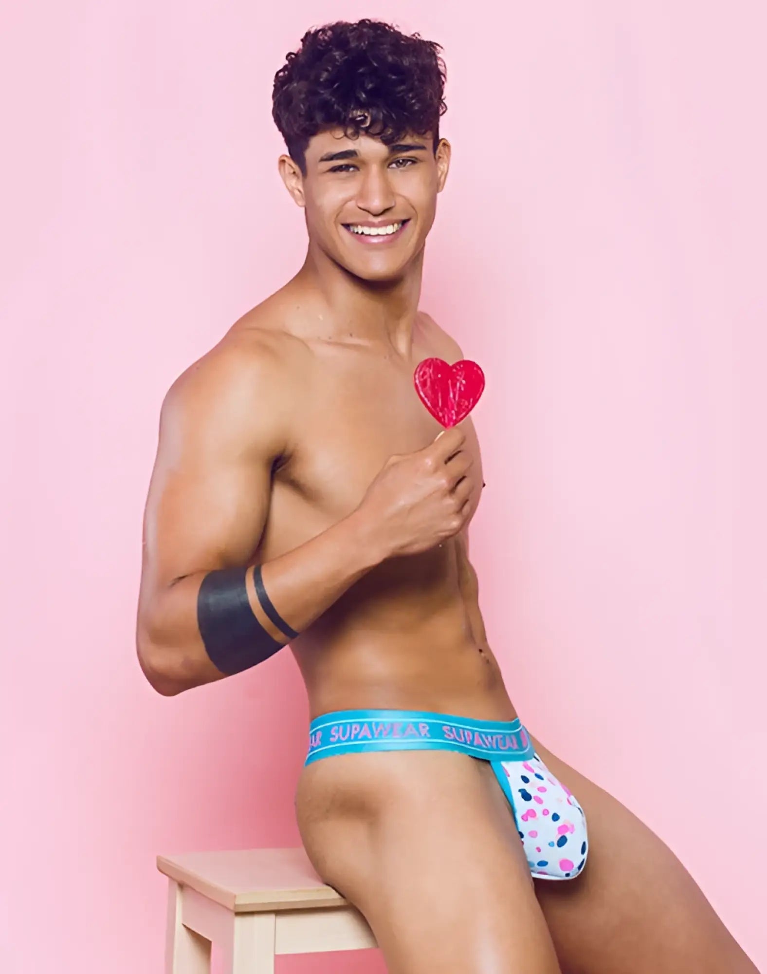 Blue and white polka dot supagear sprint thong underwear showing back side with stretchy fabric and ditsy dots design