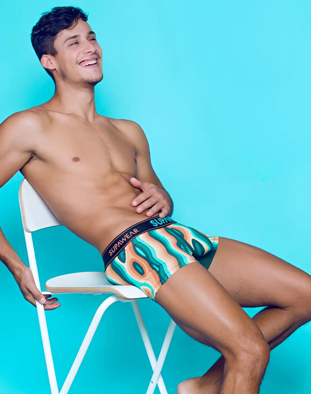 Men’s supawear sprint trunk underwear in woody orange with vibrant teal orange and cream wavy pattern boxer briefs