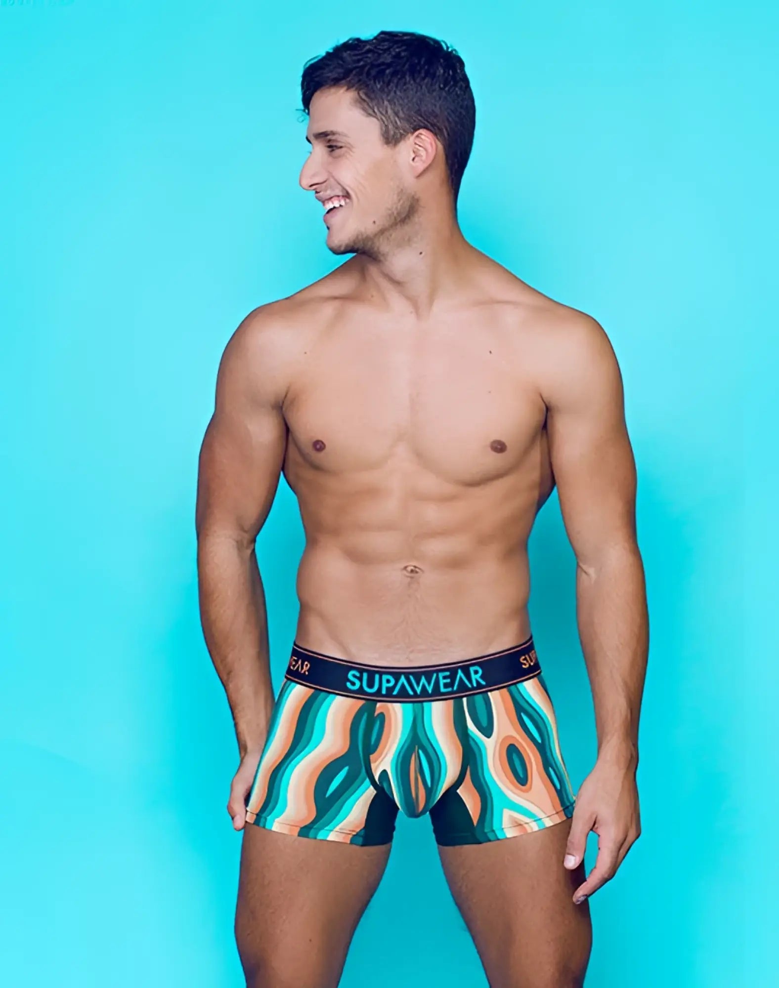 SupaWear Sprint Trunk underwear in woody orange with vibrant teal orange and black abstract patterns and breathable fabric