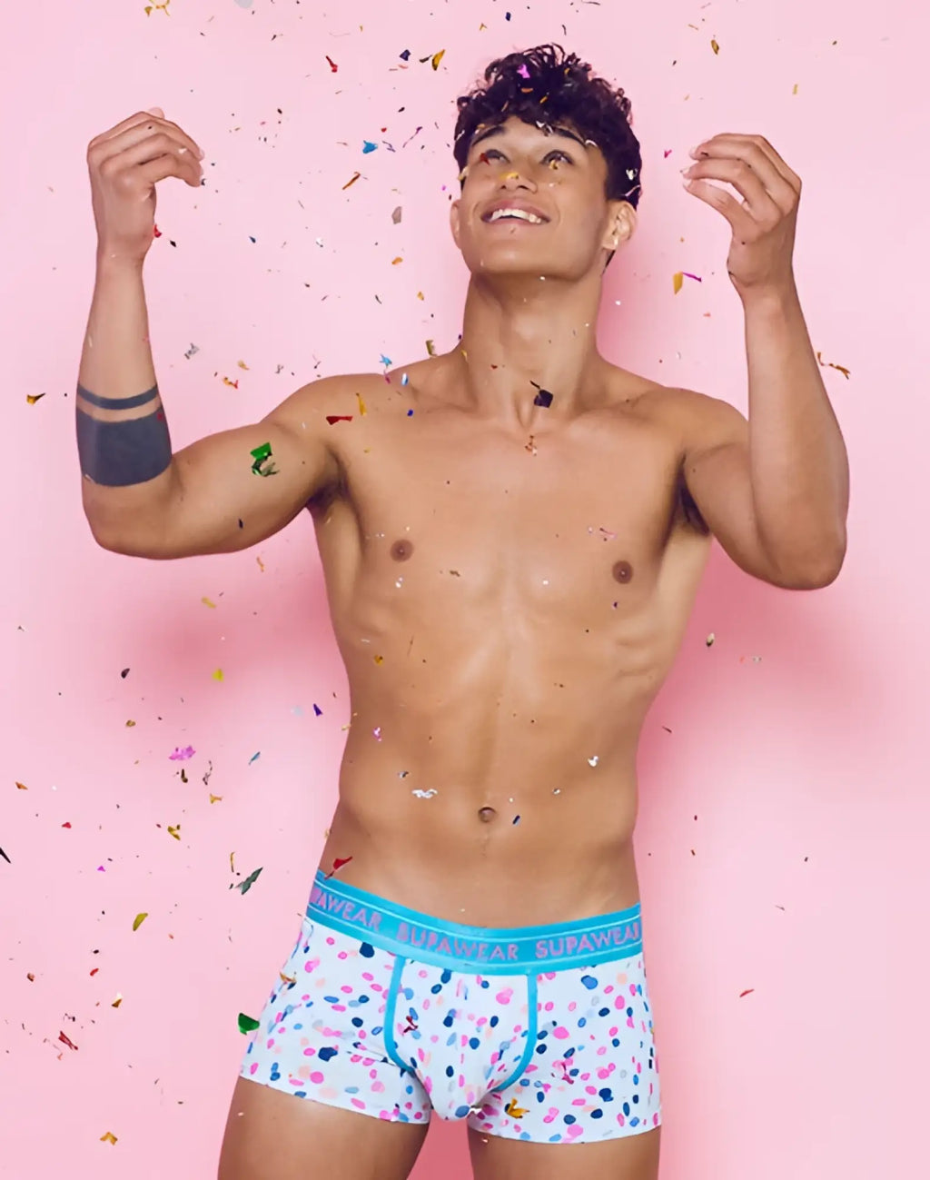 White boxer briefs with playful pink blue and black polka dots and turquoise supawear branded waistband sprint trunks underwear