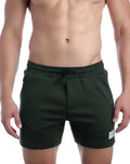 SupaWear strike shorts in forest dark green with drawstring waistband and side pockets designed for athletic use