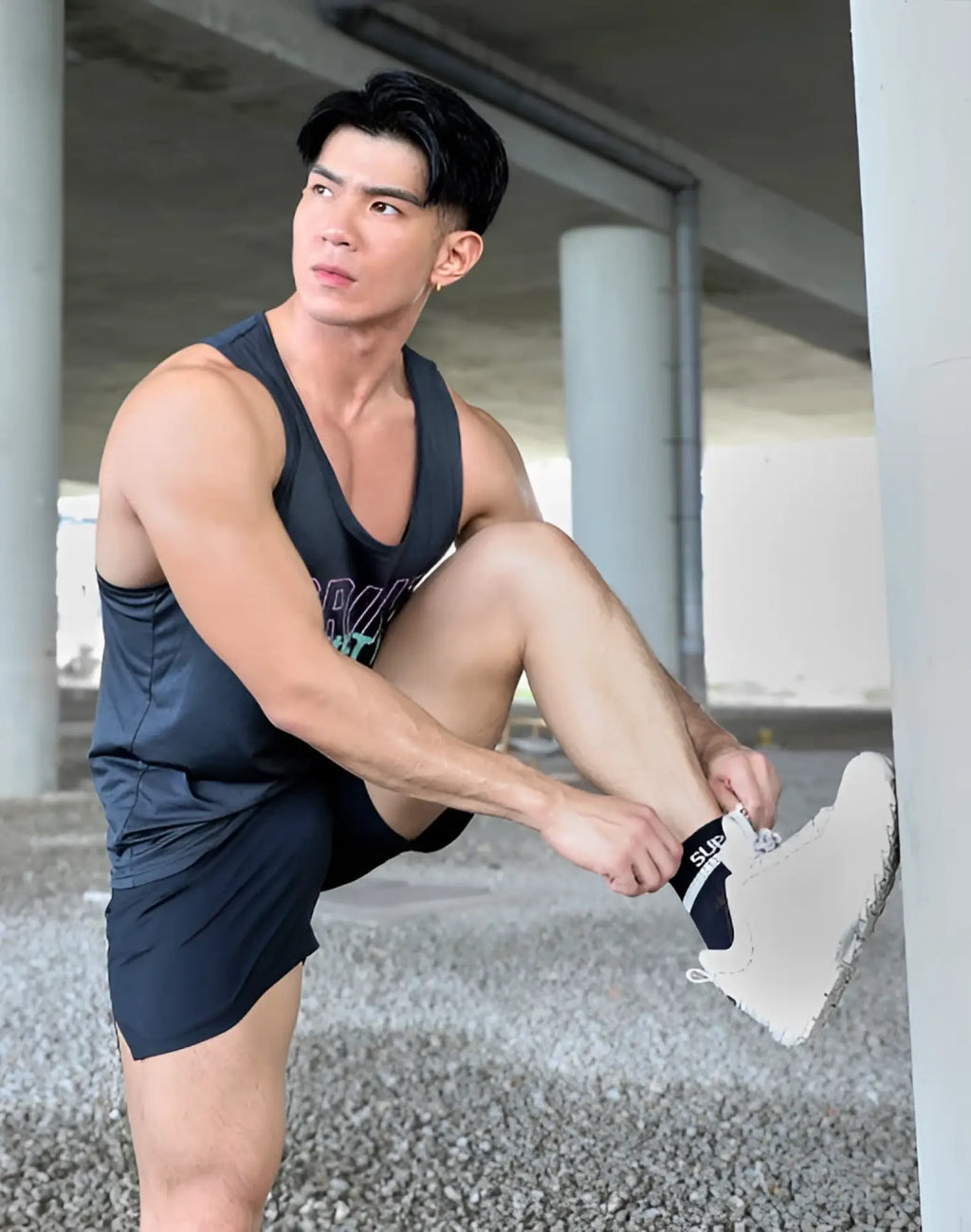 White athletic shoe wearing black supawear supa ankle socks with textured sole visible for comfort and grip