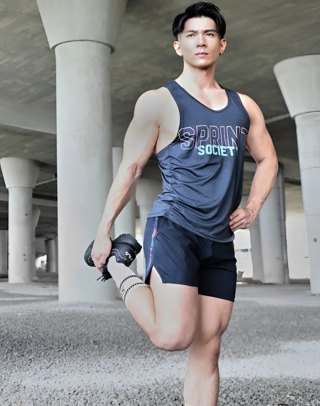 Dark gray sleeveless athletic tank top with sprint society print paired with white supawear supa crew socks