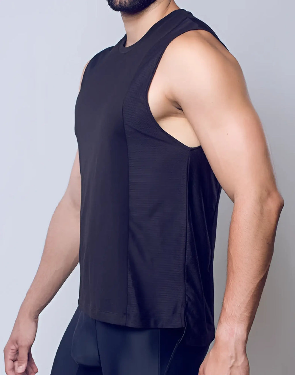 Black sleeveless SUPAWEAR Supa Pro Singlet with mesh side panel designed for athletic performance