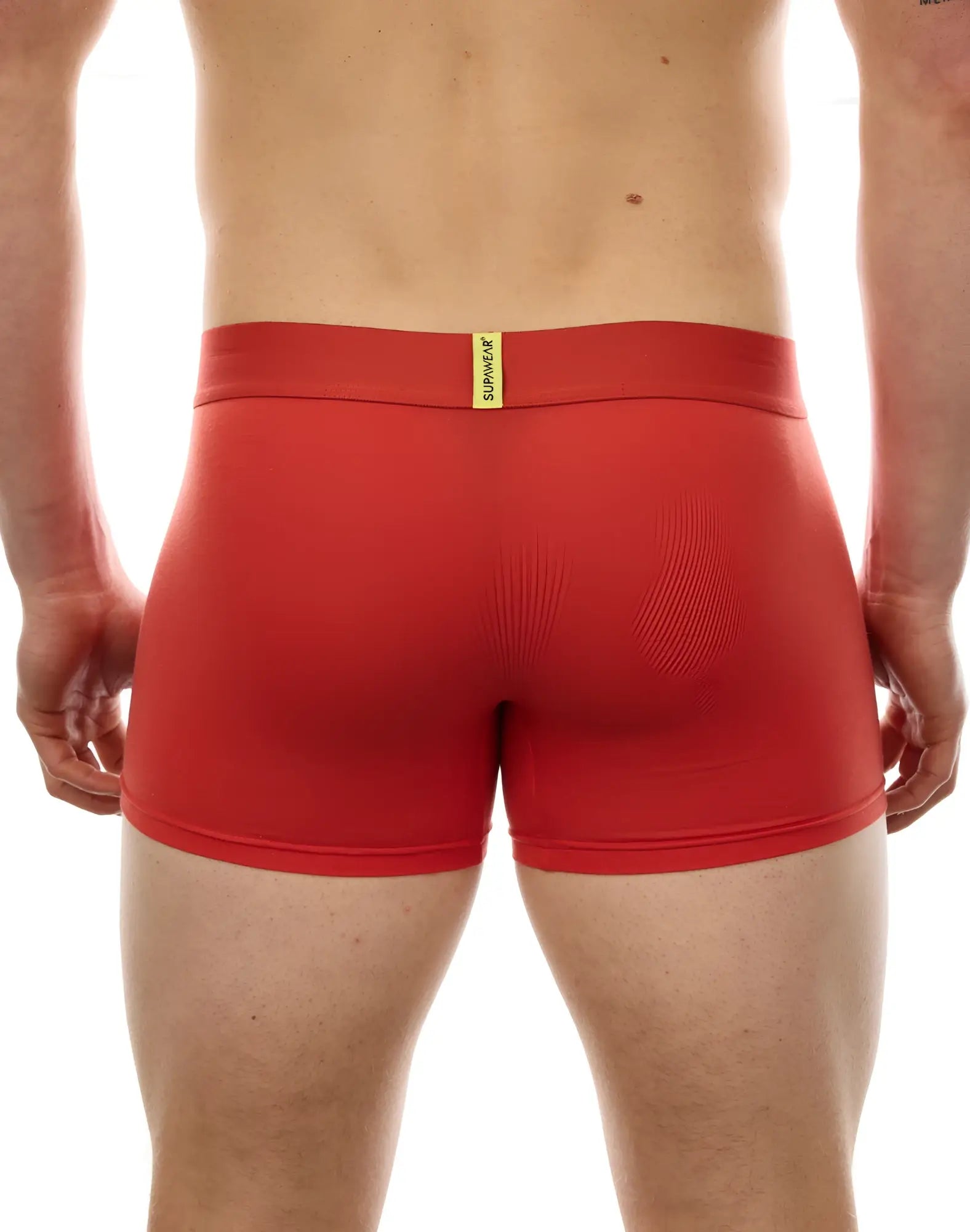 Red supawork boxer briefs with yellow supawear tag on waistband designed for comfort and support