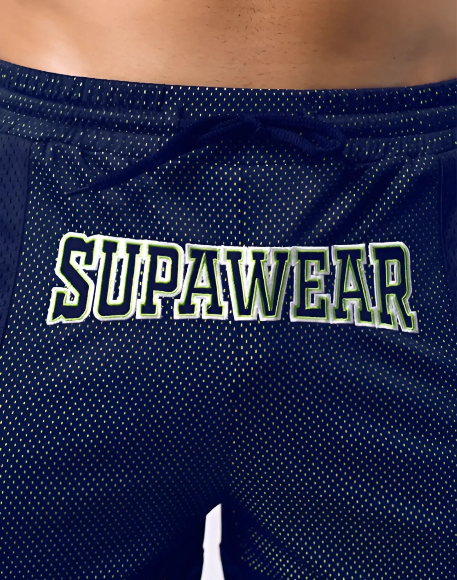 Navy blue supawear swish mesh shorts with white and green embroidered logo made from breathable athletic fabric
