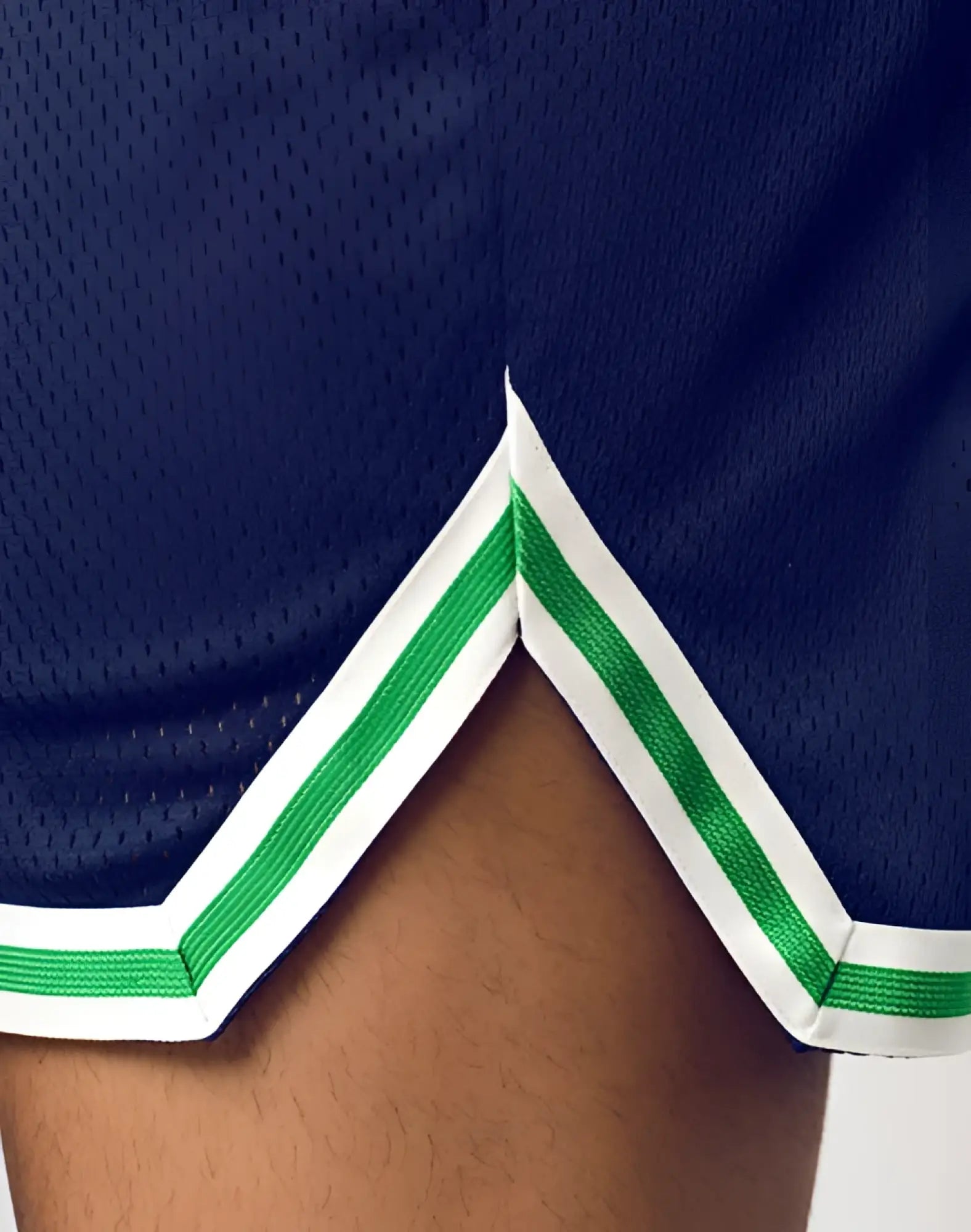 Navy blue supawear swish mesh basketball shorts with white and green striped trim for athletic wear