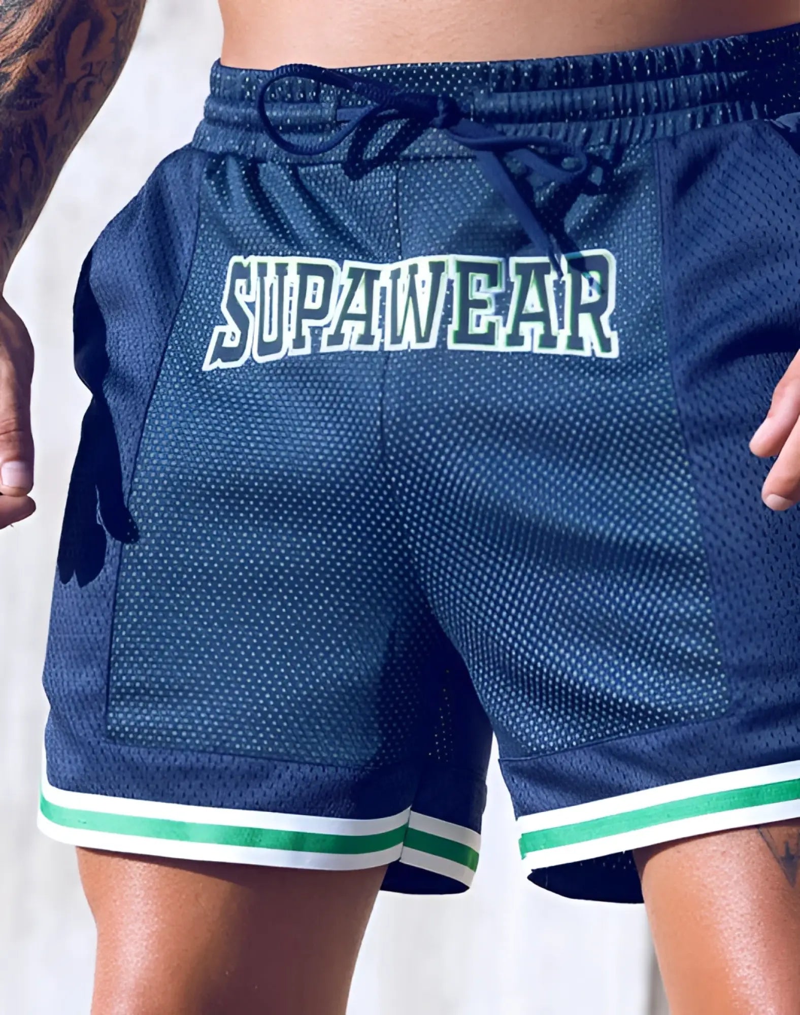Navy blue supawear swish mesh shorts with white and neon green trim featuring bold logo on front