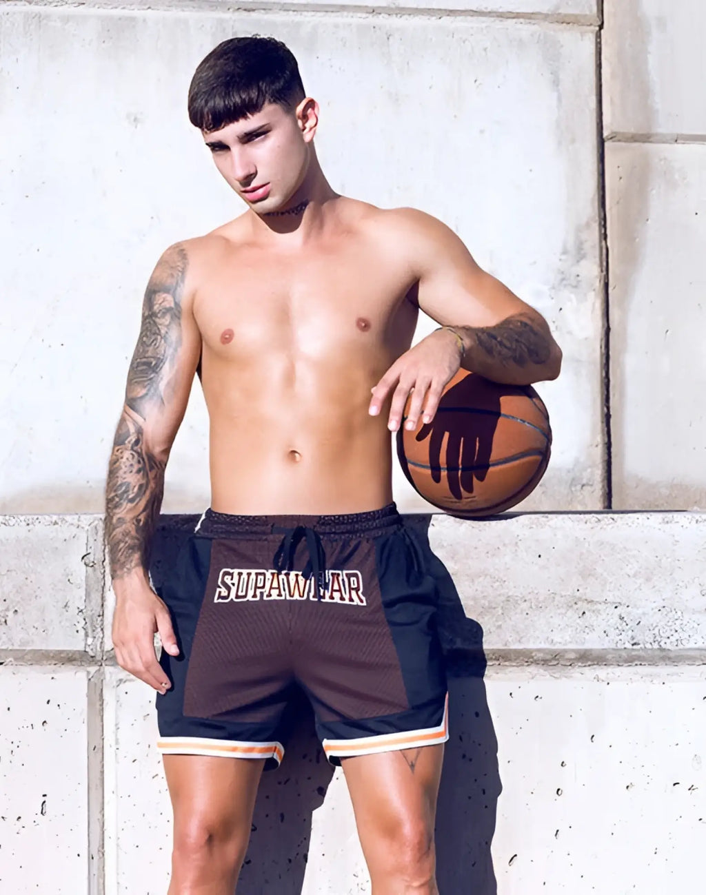 SupaWear swish mesh shorts in black and brown with white supawar branding across the front neon orange accents