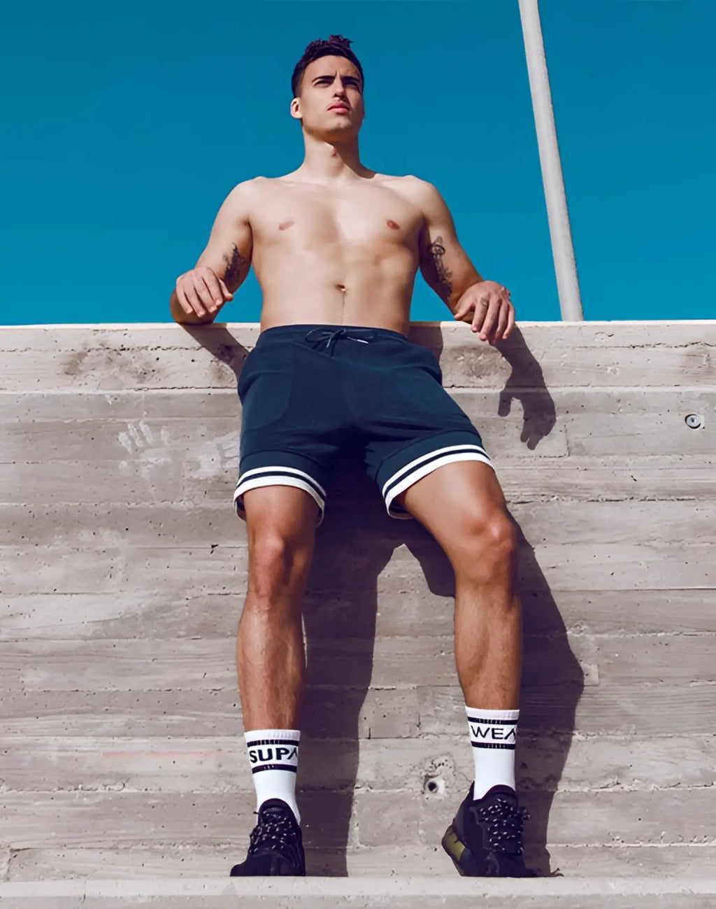 Black supawear terry towelling shorts with white trim and drawstring waistband for athletic use